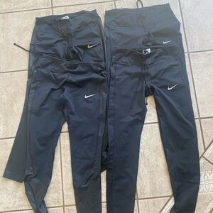 Four pairs like new Nike workout leggings